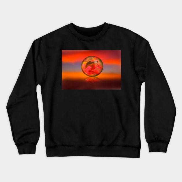 Glass globe on sunset background Crewneck Sweatshirt by RosNapier